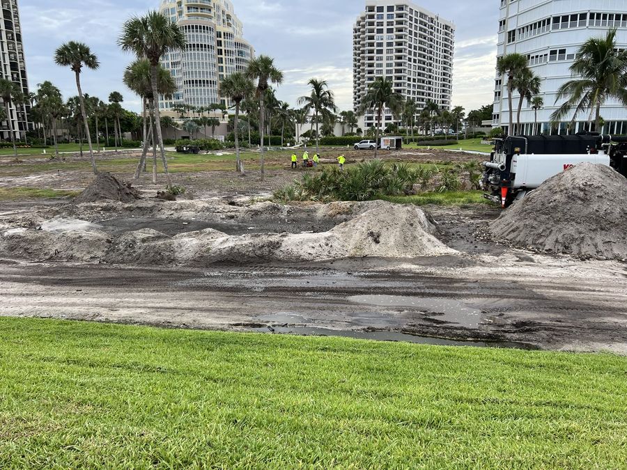 Crew grading a site after old turf removal
