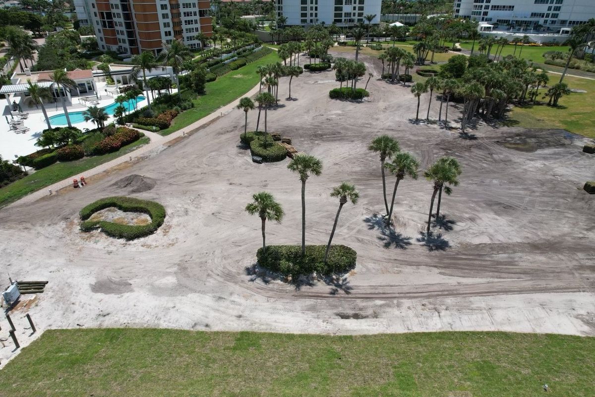 Aerial of condo grounds stripped and graded to sand