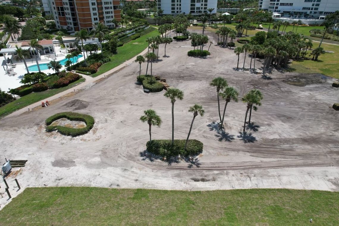 Aerial of condo grounds stripped and graded to sand