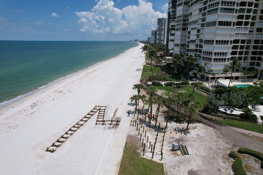 Aerial of beachfront condo grounds mid-job