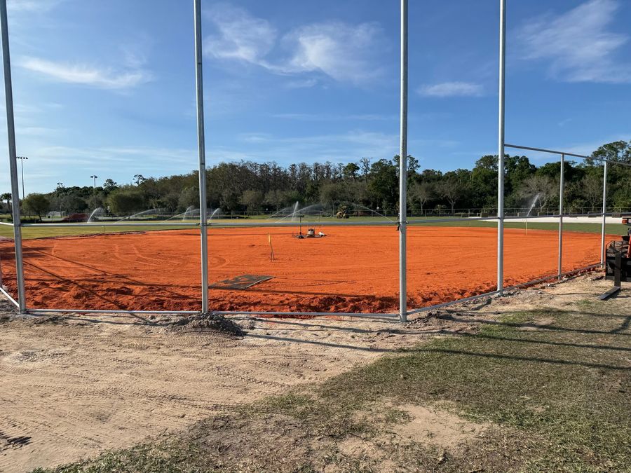 Ballfield infield with fresh clay and irrigation running