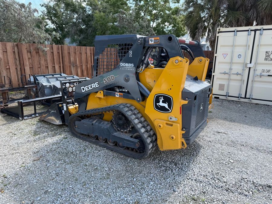 Branded compact track loader in the equipment yard